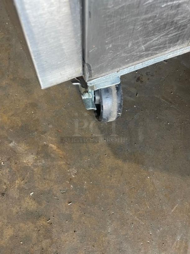 Asber ARF49 reach-in freezer caster. Stainless steel, on casters for mobility. Model: ARF49, Serial: 81002342948.