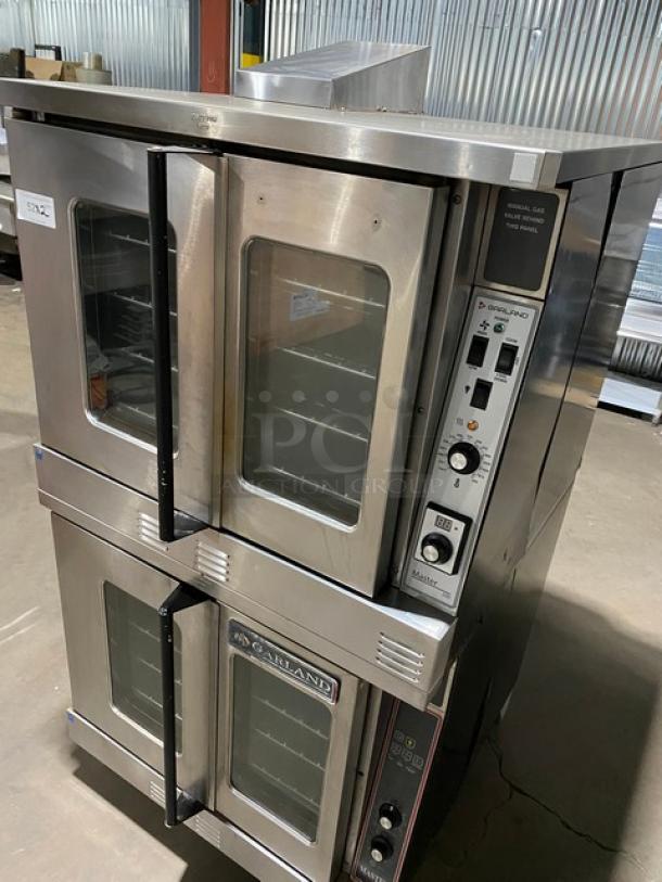 Garland Master Series double stacked stainless steel convection oven, natural gas, thermostatic control, wired racks, on legs.