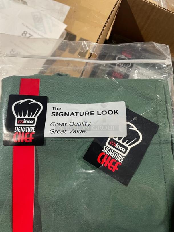 Brand new Winco Signature Chef Series green waist apron, Model WA-1221G, with 3 pockets, in original packaging.