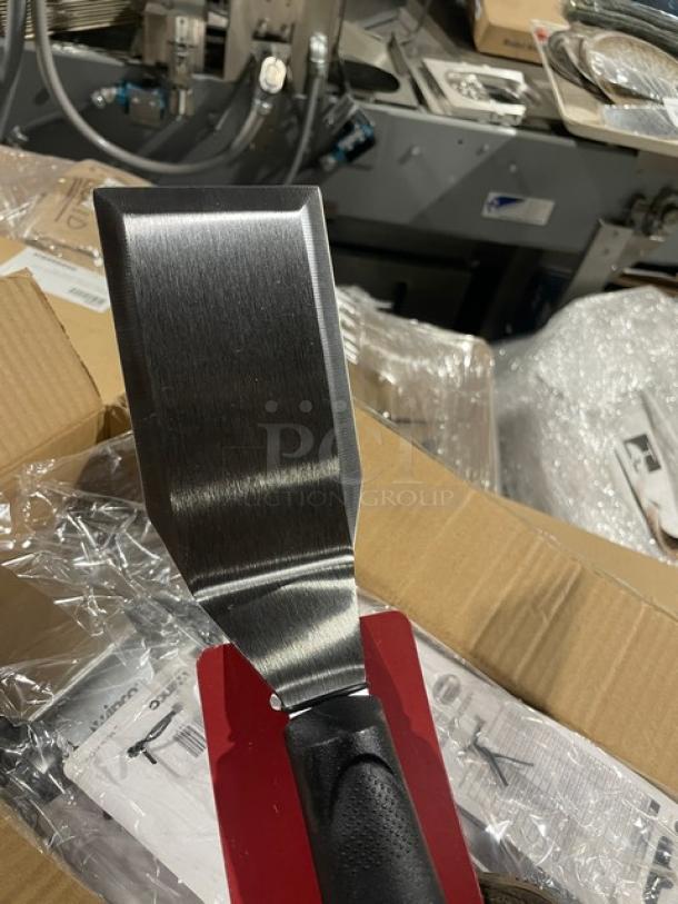 Brand new Winco TKP-61 stainless steel offset hamburger turner with black grip handle. Commercial quality.