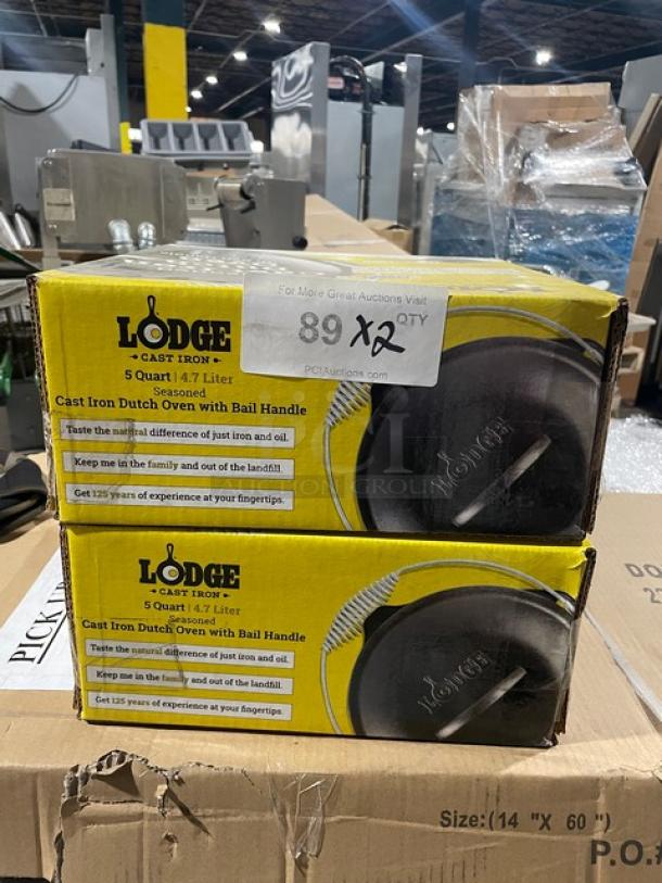 Brand new Lodge 5 Quart Cast Iron Dutch Oven, Model L8DO3, with dome lid and spiral bail handle. Boxed, mint condition.