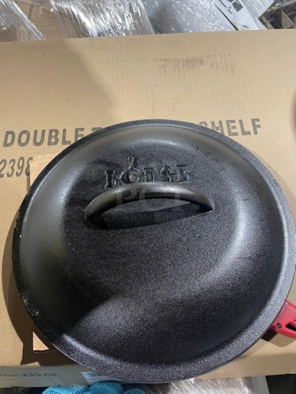 Brand new Lodge L8DO3 5 Quart Cast Iron Dutch Oven with dome lid and wired spiral bail handle, in original box.