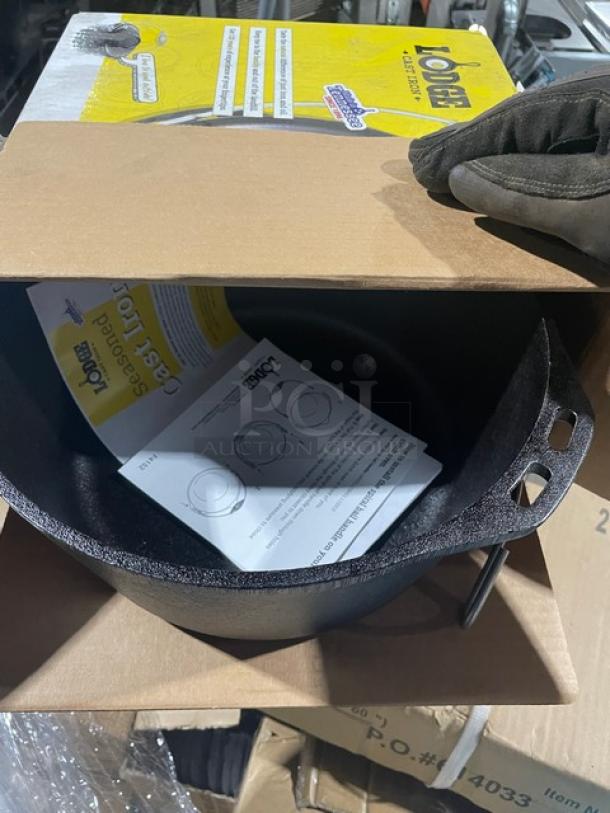 Lodge Model L8DO3 5 Quart Cast Iron Dutch Oven, new in box. Includes dome lid and wired spiral bail handle.