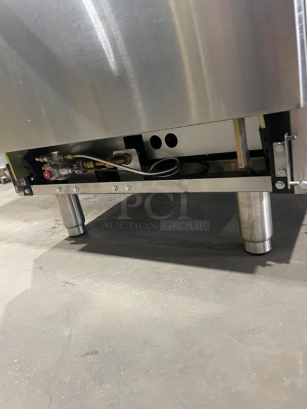 Brand new Atosa Cook Rite natural gas griddle range, model ATO-24G, with stainless steel overshelf and rack. On casters.