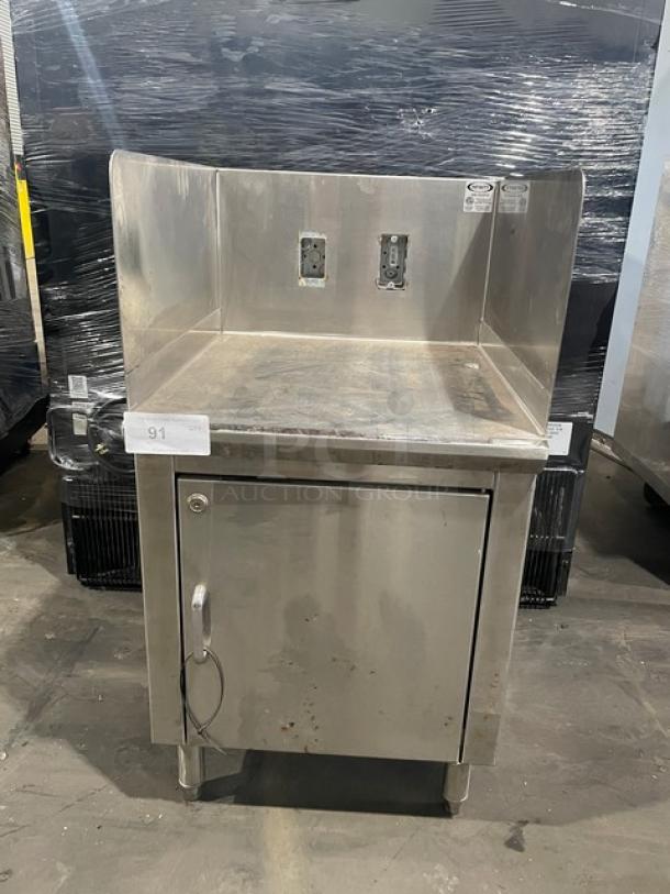 Infinity LCD-24-PT-M stainless-steel equipment base cabinet, custom-made with legs and rear outlets, showing slight wear.