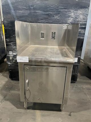 Infinity LCD-24-PT-M stainless-steel equipment base cabinet, custom-made with legs and rear outlets, showing slight wear.