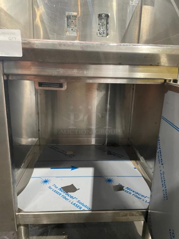 Infinity LCD-24-PT-M stainless steel equipment base cabinet with open storage space, mounted on legs. New condition.