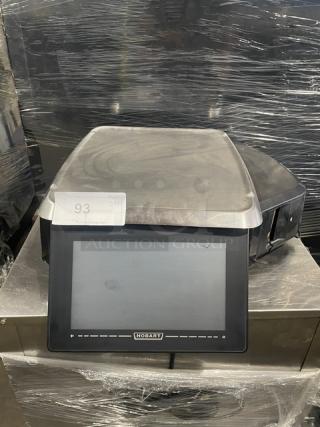 Hobart HTi commercial scale with stainless steel platform, label printer, and touchscreen display. Serial: 45-1223-253.