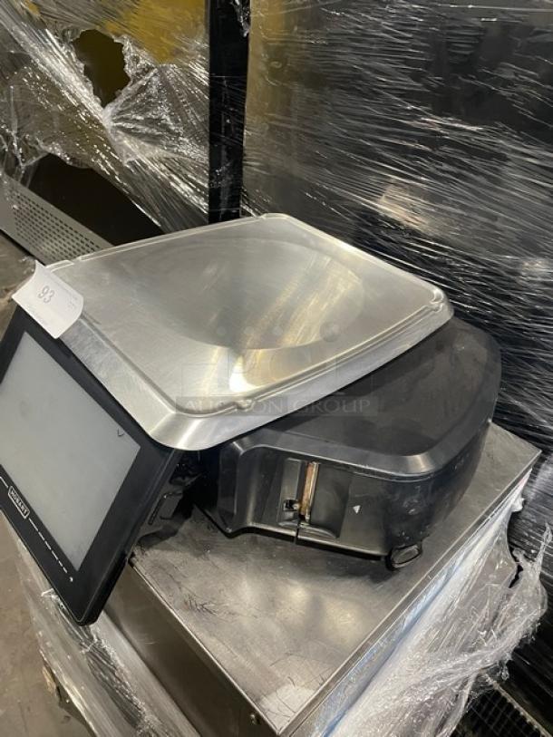 Hobart HTi black electric price computing scale with label printer, features a stainless steel platform, serial 45-1223-253.