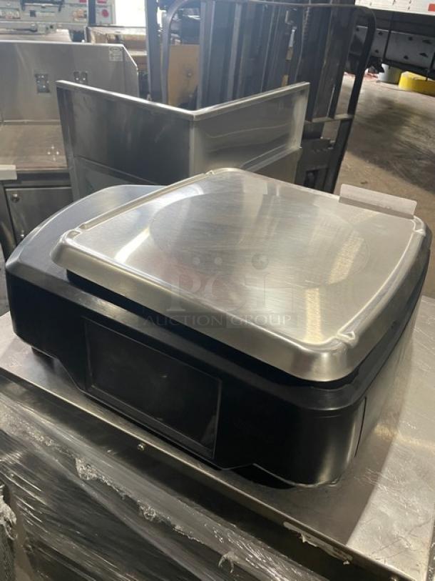 Hobart HTi commercial countertop scale with stainless steel platform and label printer, black, model HTi, serial 45-1223-253.