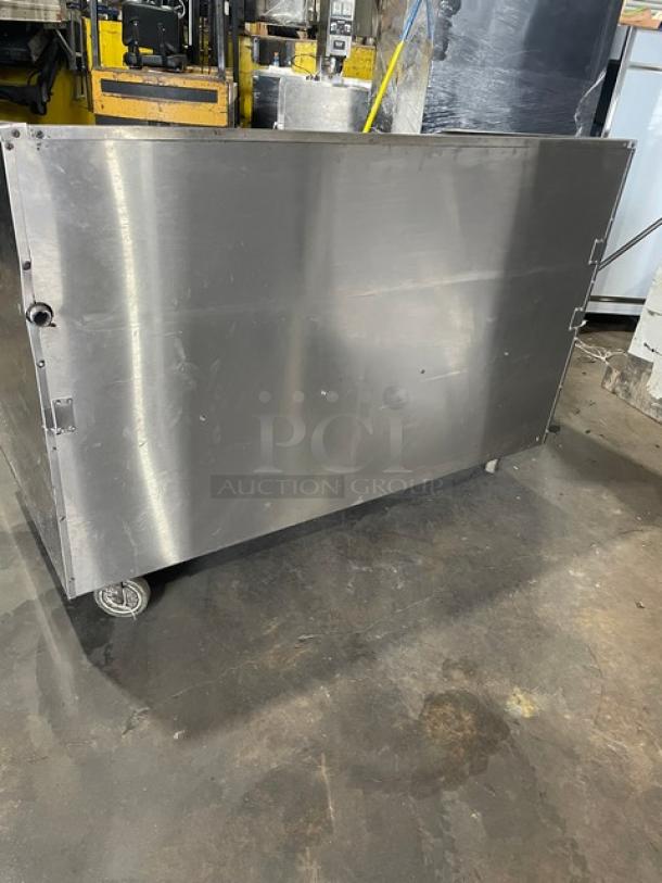 Bakers Pride F60R stainless steel charbroiler on casters, features a slide-out grease drawer, work deck, and wired racks.