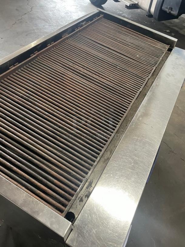 Bakers Pride F60R commercial charbroiler, stainless steel, natural gas, 60", with cabinet base, grease drawer, casters.