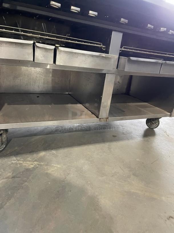 Bakers Pride 60" stainless steel charbroiler, model F60R, with enclosed cabinet, work deck, grease drawer, water pans, on casters.