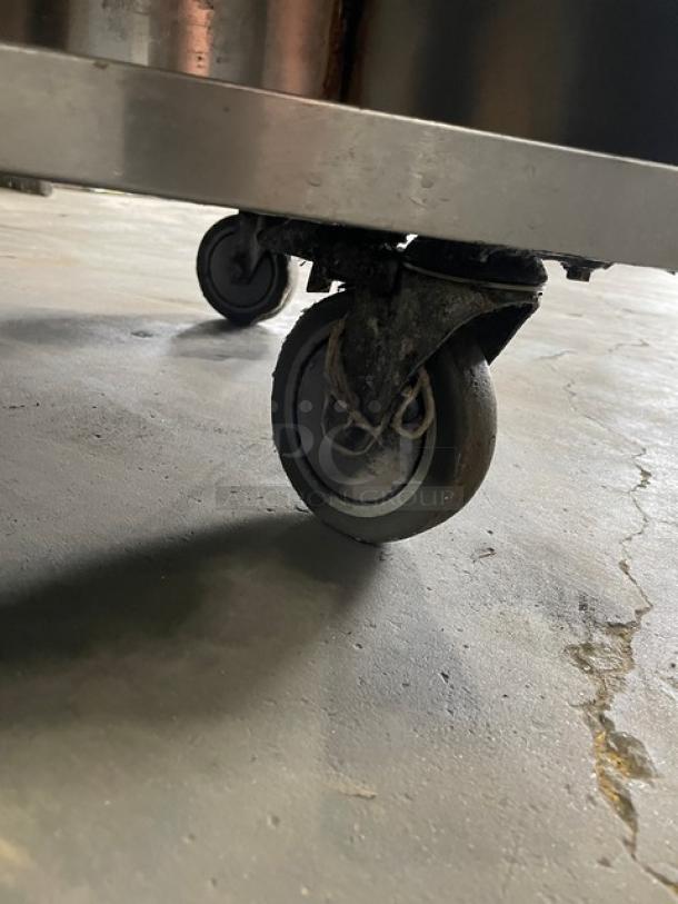Bakers Pride F60R commercial stainless steel charbroiler on casters, featuring a front-mounted work deck and deep slide-out grease drawer.