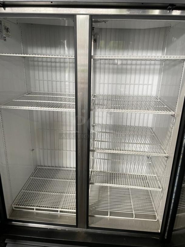 True GDM-43F-HC~TSL01 commercial freezer, black, double glass doors, poly-coated wire racks, 115V, excellent condition.