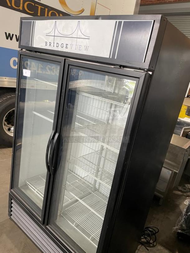 True Commercial Double Glass Door Freezer, model GDM-43F-HC~TSL01. Black finish, poly coated wire racks, 115V, excellent condition.