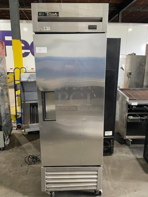 True T-23-HC stainless steel reach-in refrigerator with solid single door, poly-coated wire racks, 115V, on casters.