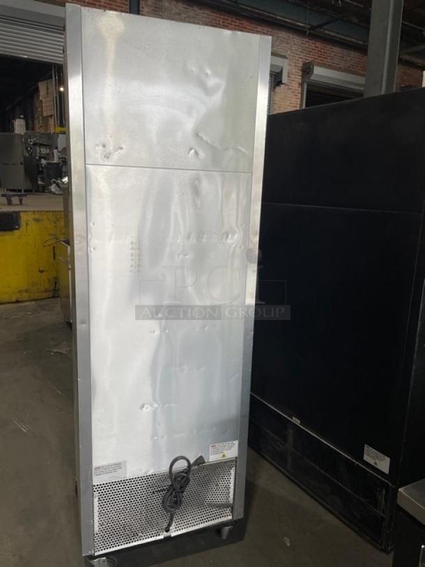 True T-23-HC stainless steel single door reach-in refrigerator. Features poly-coated wire racks, 115V, on casters. Model and serial numbers visible.