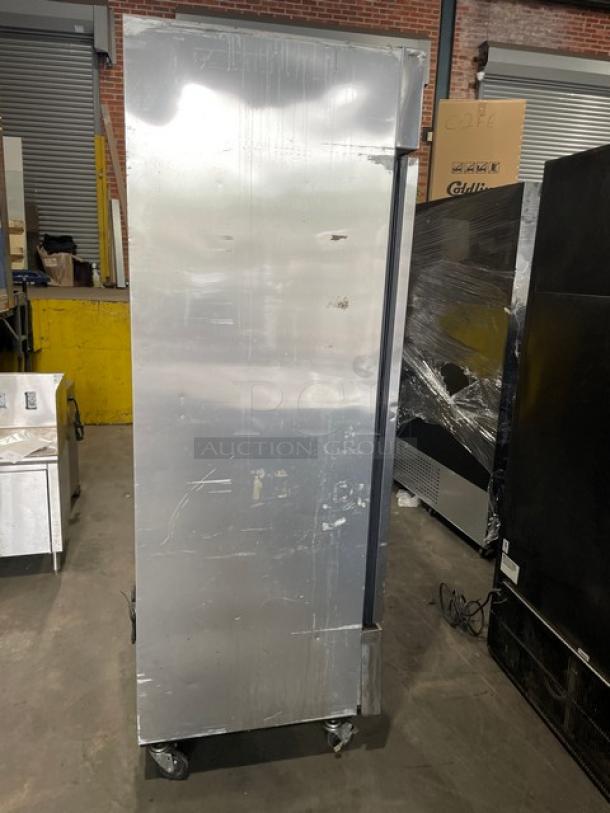 True T-23-HC commercial stainless steel reach-in refrigerator with poly-coated wire racks, single door, on casters.