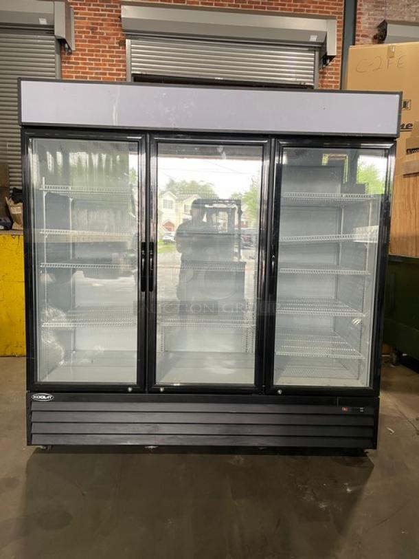 LIKE-NEW Kool-It 2020 Model KGM-75 black triple glass swing door merchandiser fridge with poly coated wire racks.