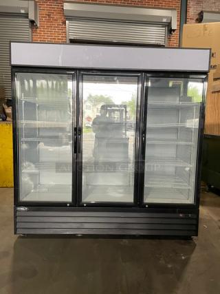 LIKE-NEW Kool-It 2020 Model KGM-75 black triple glass swing door merchandiser fridge with poly coated wire racks.