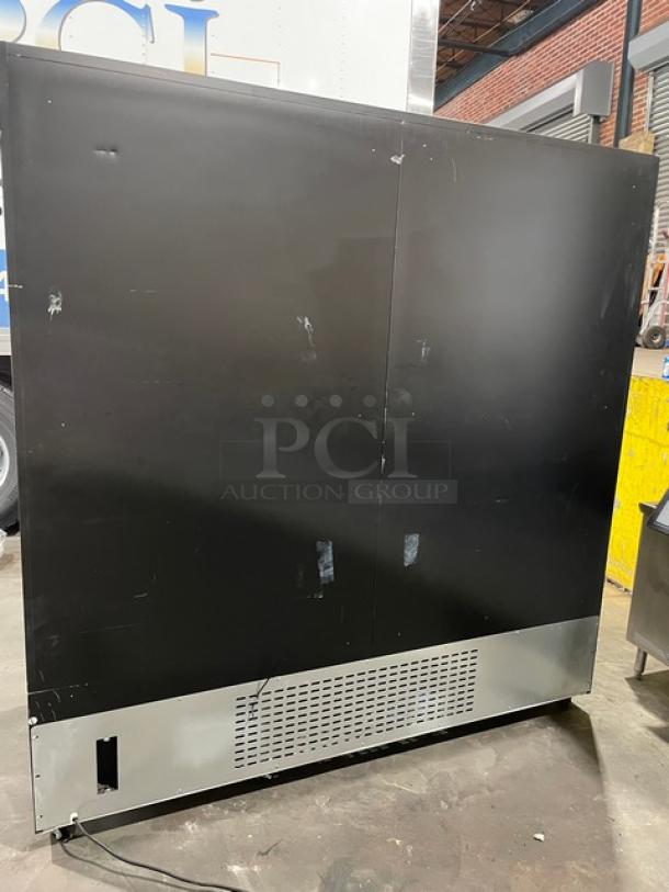 Kool-It KGM-75 commercial black triple glass swing door reach-in merchandiser refrigerator, lightly used, on casters.