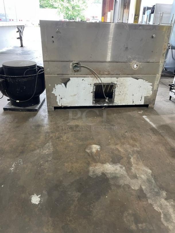 Commercial stainless steel kitchen exhaust hood with filter and electric fan, used condition, all-in-one unit.