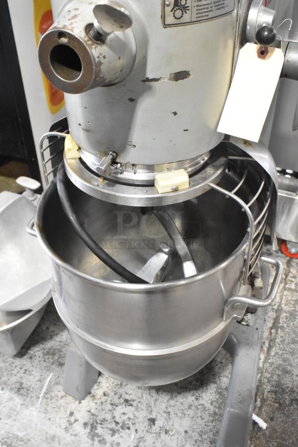 Hobart D3-40 commercial dough mixer with 40-quart stainless steel bowl, bowl guard, dough hook, and paddle attachments.