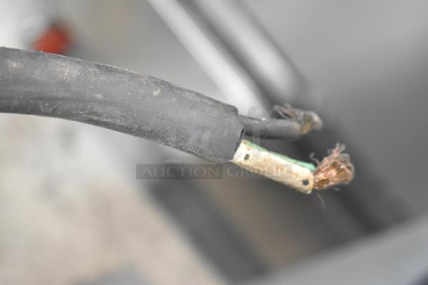 Close-up of the frayed electrical cord of a Hobart D3-40 commercial dough mixer, showing exposed wiring.