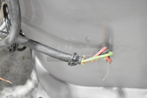 Close-up view of power cable for Hobart M 802 metal commercial dough mixer. Wiring detail shown with exposed internal wires.