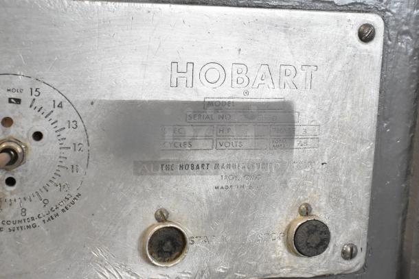 Hobart M 802 commercial dough mixer nameplate showing model, serial no. 45-4530, voltage, and settings.