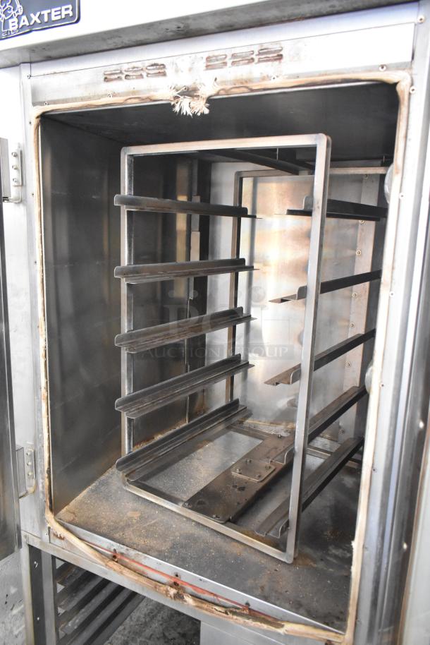 Baxter stainless steel commercial mini rotating rack oven with dual pan rack on casters, used condition, interior view.
