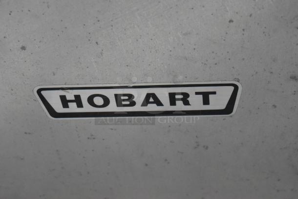 Metal surface with Hobart logo, from Hobart 84186 Commercial Countertop Buffalo Chopper, 115V, 1 Phase.