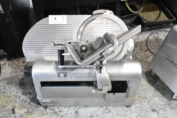 Hobart 1712 stainless steel commercial meat slicer, 115V, 1 phase, with automatic features. Used condition, Model 1712.
