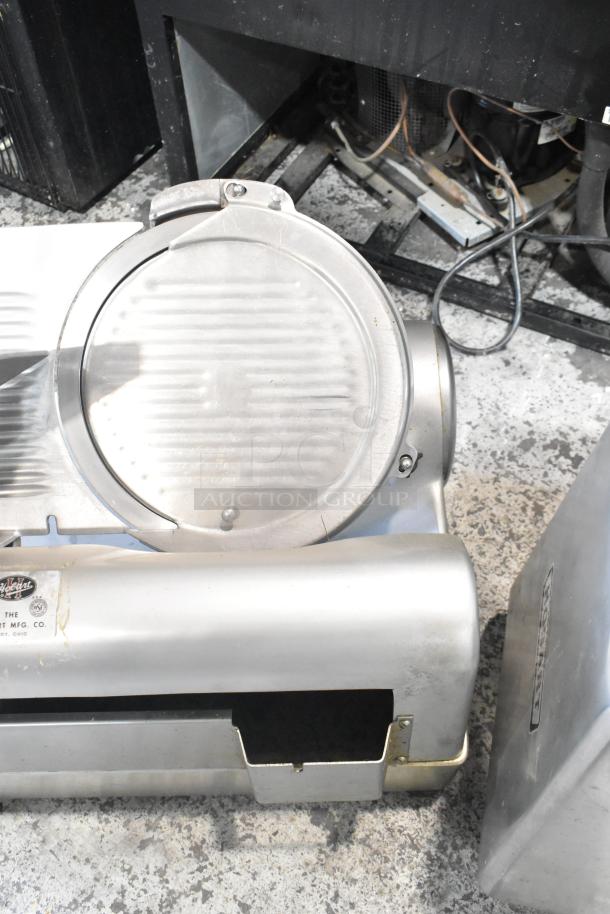 Hobart 1712 stainless steel automatic meat slicer, commercial countertop model, 115 volts, 1 phase, seen in used condition.