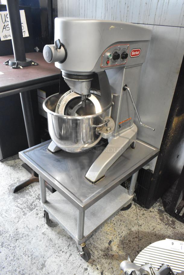 Berkel FMS20 metal commercial 20-quart dough mixer with stainless steel bowl, bowl guard, dough hook, on stand with casters.