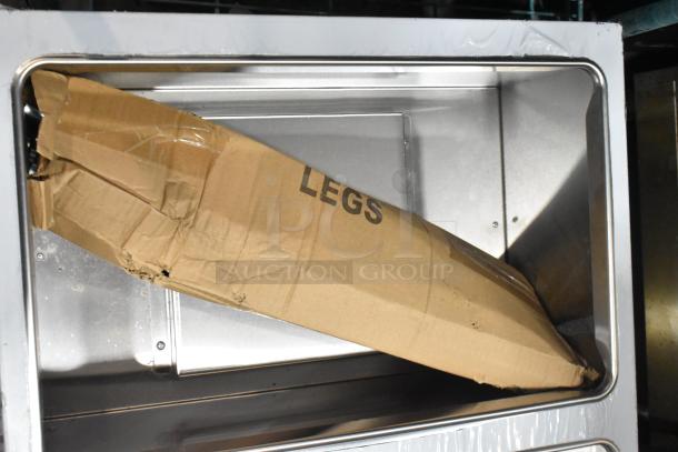 Brand new ServIt 423GST3WELP steam table with scratch and dent; stainless steel, natural gas, 105,000 BTU. Box labeled "Legs."