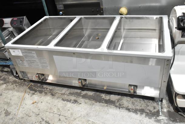 Brand new 2025 ServIt 423GST3WELP stainless steel steam table, three-pan open well, natural gas, 105,000 BTU, minor dents.