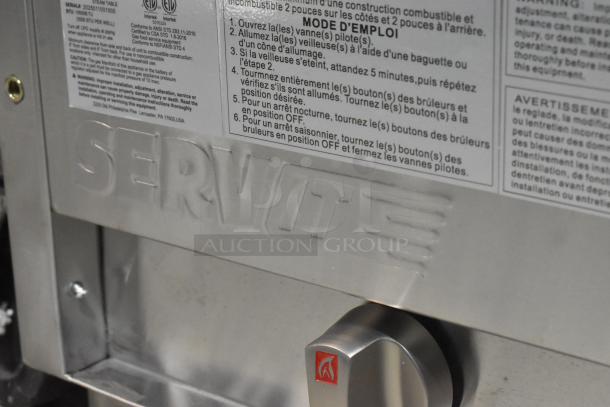 Brand new 2025 ServIt 423GST3WELP stainless steel gas-powered steam table. Features include 105,000 BTU, three-pan capacity, visible logo and safety instructions.