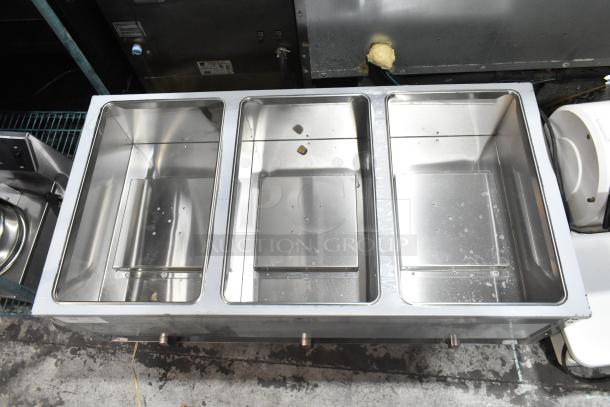 Brand new ServIt 423GST3WELP stainless steel steam table with three open wells. Natural gas, 105,000 BTU, scratch and dent.