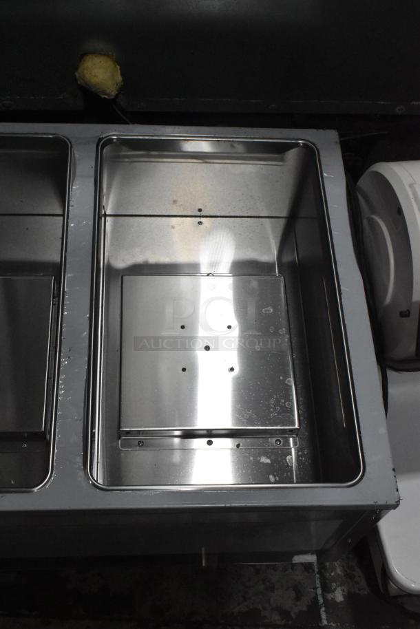 BRAND NEW ServIt 423GST3WELP stainless steel steam table with three open wells. Natural gas powered, 105,000 BTU. Some scratches.