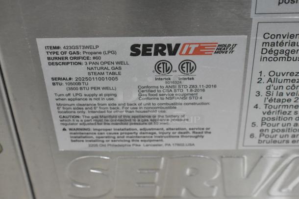 New ServIt 2025 stainless steel steam table, model 423GST3WELP, featuring three pan open wells, 105,000 BTU, and natural gas power.