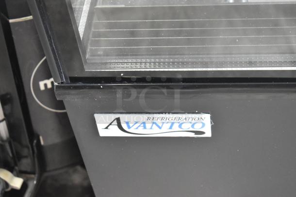 Avantco 193BC60HCB 60" refrigerated bakery display case, black with curved glass. Note visible broken glass.