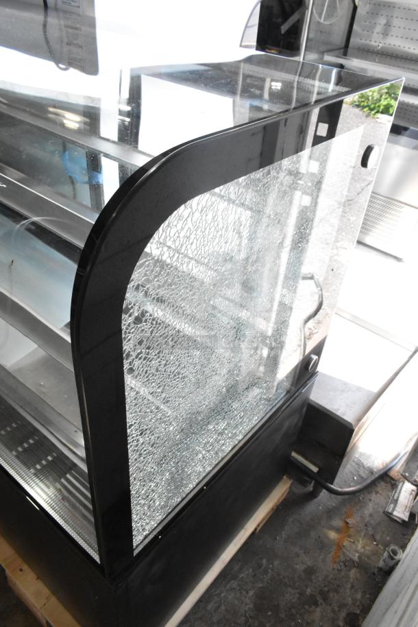 Brand new Avantco 193BC60HCB 60" curved glass refrigerated bakery display case with visible broken glass on side.