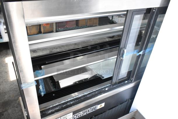 Brand new Avantco 193BC60HCB 60" curved glass bakery display case, minor defects including broken glass, 110-120 volts, 1 phase.