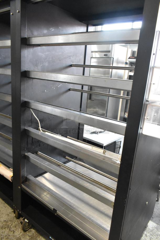 Lakeside metal bakery bagel display case on casters, showcasing five metallic shelves, 125V, commercial-grade condition.