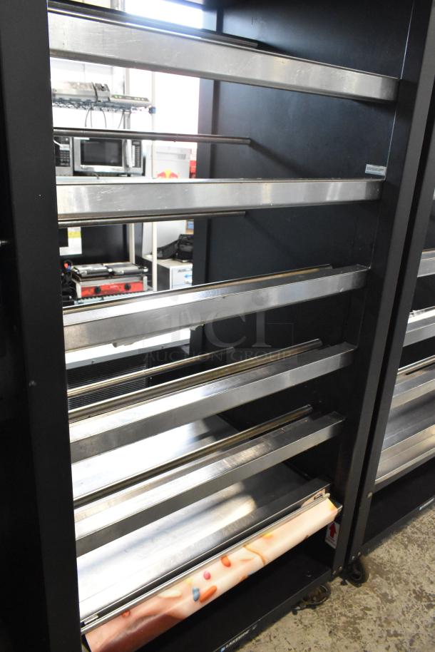 Lakeside metal bakery display case on casters, adjustable shelves, 125 volts, excellent condition, commercial use.