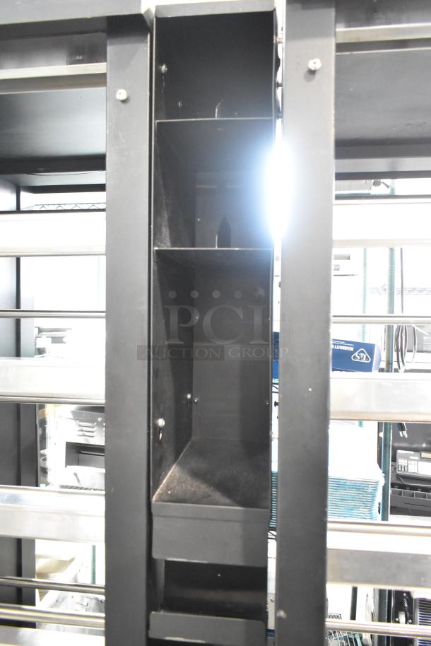 Vulcan 1015021 metal bakery display case on casters, black shelves, 125V, 1 phase, for commercial use, good condition.