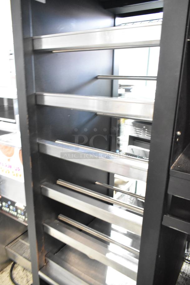 Vulcan 1015021 metal bakery display case, adjustable shelves, on commercial casters, 125V, 1 phase, used condition.