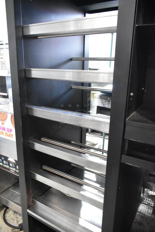 Vulcan 1015021 metal bakery display case rack on casters. Multiple shelves, sturdy metal design, ideal for pastries.
